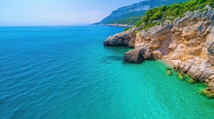 Coastal mountain cliffs with turquoise ocean, aerial view, waves crashing against rocks, mountain meets sea, dynamic nature, dramatic coast