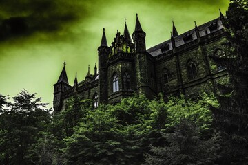 Fototapeta premium Dark Gothic Castle in Misty Atmosphere with Tilt-Shift Effect for Atmospheric Photography