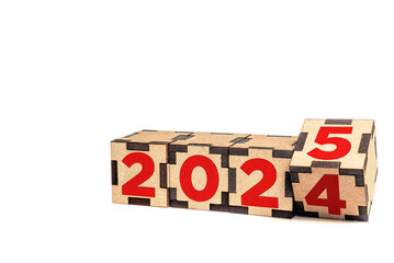 Wooden blocks transitioning year from 2024 to 2025