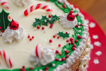 Festive holiday cake decorated with candy and greenery