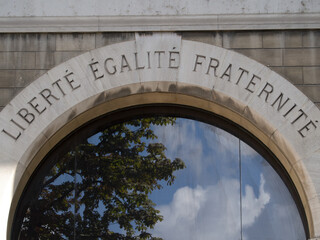 Liberty, Equality, Fraternity, the motto of the French revolution on the wall of Hotel de Ville in...
