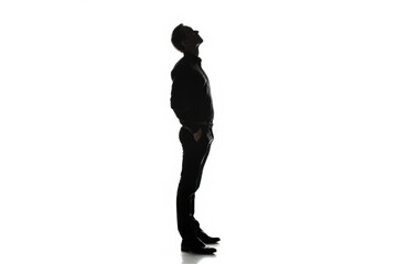Caucasian businessman standing and looking up in studio.