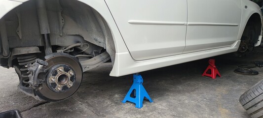 Car on Jack Stands in Auto Repair Shop