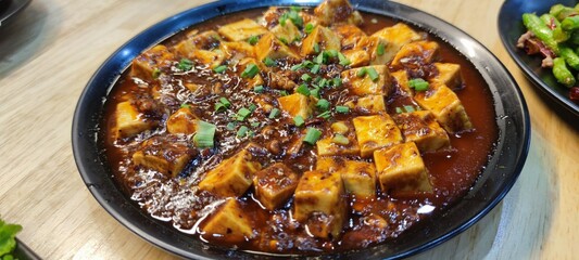 Spicy Tofu with Sauce and Vegetables in Bowl