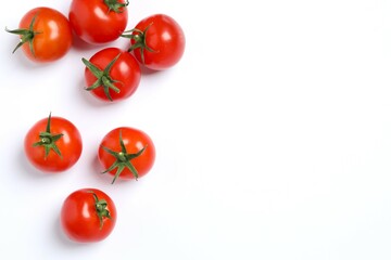 Flat lay composition with fresh cherry tomatoes on white background. Ripe vegetables