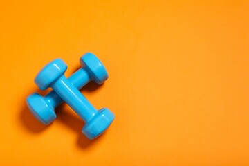 Sport equipment on color background, top view