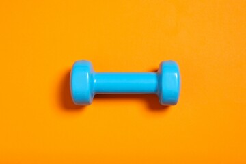 Sport equipment on color background, top view