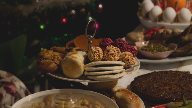 A platter of ampaw or puffed rice, puto or rice cake and kutsinta and other Filipino sweets for the Media noche or New Year eve feast that shows the authentic Philippines beliefs and culture 