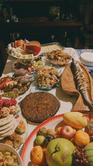 A festive table filled with a variety of local traditional Filipino dishes for the New year media noche meal celebration in the Philippines