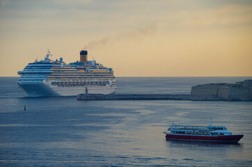 Modern Italian family cruiseship cruise ship liner Fascinosa morning arrival into port of Valletta,...