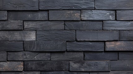 Naklejka premium Weathered Black Bricks Wall with Moss and Chipped Paint Texture Close-Up