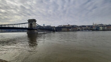 Budapest, Hungary, 02.15.2024,  view of the Danube from the Szechenyi Chain Bridge on a winter cloudy day