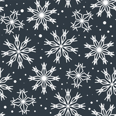 White big and small snowflakes in a seamless pattern on a dark gray background