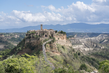 Bagnoregio, Italy - September 28 2024: Panoramic view on Civita di Bagnoregio. Picturesque Ancient Hilltop Etruscan era village with Historic Architecture and Stunning Panoramic Views. Italian summer.