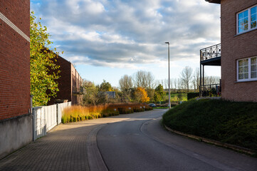 Houses and a bending road in the village of Sint Gertrudis Pede, Dilbeek, Flanders, Belgium, OCT...