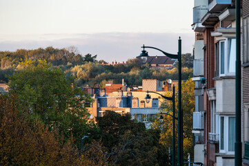 Sunset cityscape over a steep sloped street and hill in Anderlecht, Brussels Capital Region, Belgium OCT 23, 2024