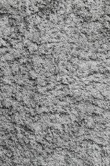 Background, texture of a gray uneven rough wall made of stone, cement.