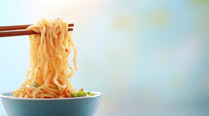 Dandan Noodles Twirled on Chopsticks

Chopsticks lifting a serving of spicy dandan noodles, thick sauce clinging to the noodles with visible chili oil droplets, on a pale background.