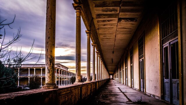 Silhouette of Abandoned Column Corridor in Eleousa Sanatorium, Rhodes, Greece - Evocative Architectural Photography