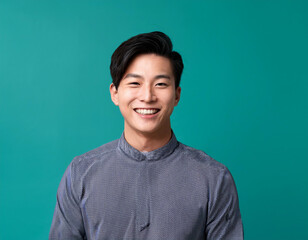Happy Man Smiling Against Colorful Studio Background