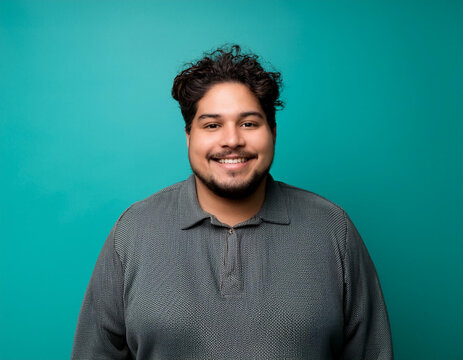 Happy Man Smiling Against Colorful Studio Background