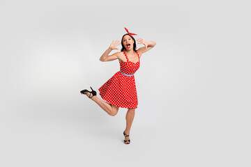 Full body photo of attractive woman have fun enjoy holiday dressed red vintage style polka dot skirt isolated on white background