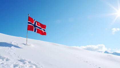 Norwegian flag on snowy mountain under bright winter sun
