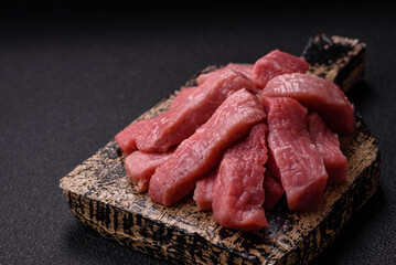 Juicy beef cut into slices with salt, spices and herbs