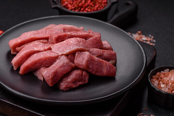 Juicy beef cut into slices with salt, spices and herbs