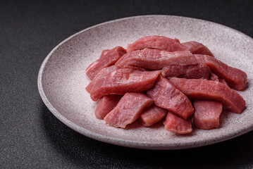 Juicy beef cut into slices with salt, spices and herbs