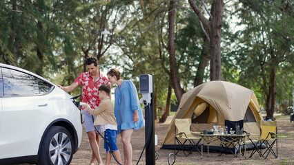 Outdoor adventure and family vacation camping in nature travel by eco friendly car for sustainable...