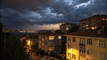 Obraz premium Timelapse of Clouds Over Istanbul: A Stunning Night View of Illuminated Residential Buildings