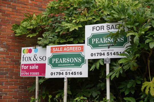 Romsey England 14 October 2024 - Pearsons and Fox & Sons estate agent For Sale signs in residential complex. Property market 