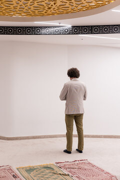 man praying salah indoors
