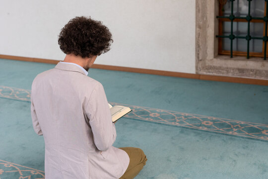 Top view of a man with a Quran