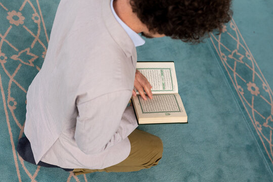Top view of a man with a Quran