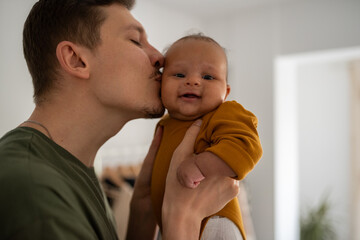 Father kissing his child