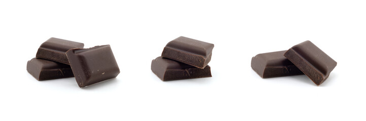 Broken chocolate. Chocolate pieces isolated. Cubes of milk chocolate bar pieces on white background as package design elements. Set of different dark chocolate pieces.