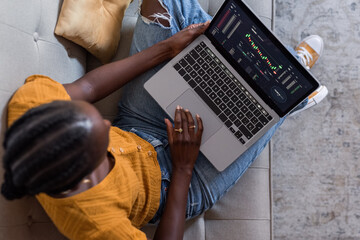Female trader using laptop
