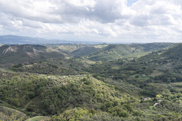 Bagnoregio, Italy - September 28: Panoramic View from Civita di Bagnoregio Overlooking the Valle dei Calanchi valley. Typical Scenic Hills and Rolling Landscapes. Italian autumn day.