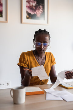 Woman calculating budget and expenses