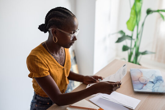 Black woman reading letter