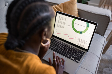 Modern businesswoman studying marketing report