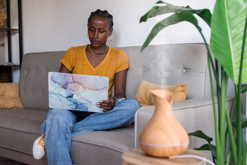 Frowning woman using laptop