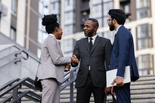 Entrepreneur shaking hands with business associate during meeting