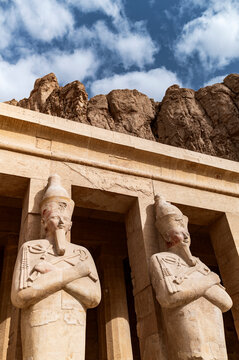 Colossal Statues of Hatshepsut Against Cliffside
