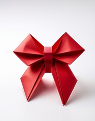 Red origami bow on white