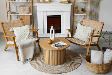 Armchairs, coffee table and fireplace in living room