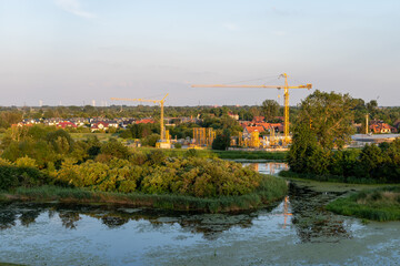 Obraz premium Development and construction works, new buildings as seen from Promenada Bastionami, Gdansk city, Poland in sunny day