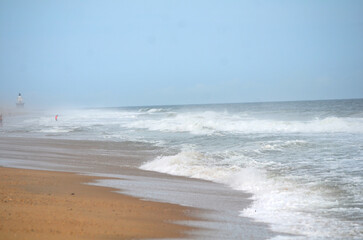 Ocean waves crashing on the beach in summer